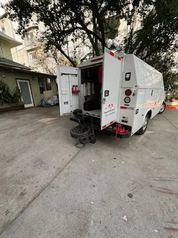 Magnet Plumbing service vehicle on-site for Grease Trap Cleaning in League City